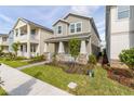 Two-story home with front porch and landscaping at 16294 Honey Harvest St, Winter Garden, FL 34787