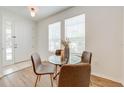 Bright dining area with glass table and four brown chairs at 7127 Harmony Square S Dr # 7127, Harmony, FL 34773