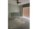 Empty living room with ceiling fan and sliding glass door at 2796 Whispering Trails Dr, Winter Haven, FL 33884