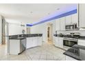 Spacious kitchen with stainless steel appliances and granite countertops at 805 Via Bianca Dr, Davenport, FL 33896