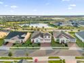Two-story house in a community with a pond at 2692 Meadowedge Loop, St Cloud, FL 34772