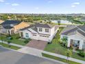 Two-story house in a community with a pond at 2692 Meadowedge Loop, St Cloud, FL 34772