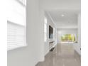 Bright and airy living room with tile flooring and large windows at 2692 Meadowedge Loop, St Cloud, FL 34772