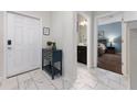 Bright entryway with tile floors and views of bedroom and bathroom at 8932 Stinger Dr, Davenport, FL 33896
