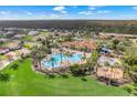 Community pool, playground, and surrounding homes at 3838 Gulf Shore Cir, Kissimmee, FL 34746