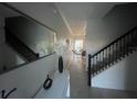 Bright entryway with staircase and mirror at 4295 Paragraph Dr, Kissimmee, FL 34746