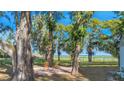 Relaxing patio seating area overlooking a tranquil lake at 4321 Rummell Rd, St Cloud, FL 34769