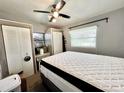 Cozy bedroom with a queen bed, closet, and window at 5312 Goddard Ave, Orlando, FL 32810