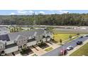 Aerial view of a townhome community with nearby road construction at 3550 Davenport Creek Ct, Kissimmee, FL 34746