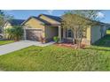 House exterior showcasing a front yard and driveway at 3911 Baja Dr, Saint Cloud, FL 34772