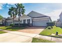 Curb appeal abounds with this one story home, featuring a covered porch at 3758 Prairie Reserve Blvd, Orlando, FL 32824