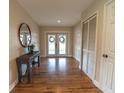 Elegant entrance hall with hardwood floors and a rustic console table at 4121 Albritton Rd, St Cloud, FL 34772