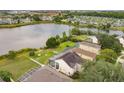 Aerial view of lakefront home with backyard at 632 Pinewood Dr, Davenport, FL 33896