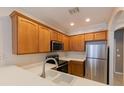Modern kitchen with stainless steel appliances and white countertops at 6364 Sedgeford Dr, Lakeland, FL 33811