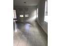 Bright and airy living room with tile floors and natural light at 6560 Candied Peel Aly, Winter Garden, FL 34787