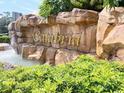 Calabria community entrance with a stone and water feature at 9016 Murano Mews Ct, Kissimmee, FL 34747