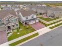 Two story home with backyard and brick paver driveway at 14442 Noto Ave, Clermont, FL 34714