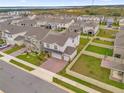 Two story home with backyard and brick paver driveway at 14442 Noto Ave, Clermont, FL 34714