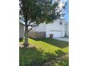 Side view of two-story house with attached garage at 255 Abbotsbury Dr, Kissimmee, FL 34758