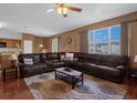 Relaxing living room with sectional sofa, coffee table, and large windows at 4523 Ashtubula Ct, Orlando, FL 32818