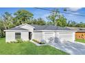 New home exterior with a two-car garage at 792 Del Prado Dr, Kissimmee, FL 34758