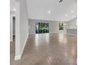 Spacious living room with tile floors and sliding doors at 792 Del Prado Dr, Kissimmee, FL 34758