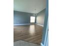 Bright dining room with light grey walls and wood-look flooring at 1021 Hacienda Cir, Kissimmee, FL 34741