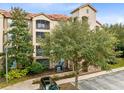 Residential building with balconies, landscaping, and parking at 1301 Tuscan Ter # 9106, Davenport, FL 33896