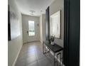 Bright and spacious entryway with tile flooring and modern decor at 1799 Caribbean View Ter, Kissimmee, FL 34747
