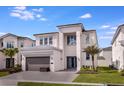 Modern two-story house with gray exterior at 2133 Pine Oak Loop, Davenport, FL 33837