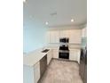 Modern kitchen with stainless steel appliances and island at 2720 Pierr St, Davenport, FL 33837