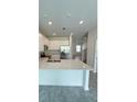 Modern kitchen with stainless steel appliances and island at 2720 Pierr St, Davenport, FL 33837
