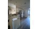 Kitchen with granite countertops and stainless steel appliances at 3077 Brenton Manor Loop, Winter Haven, FL 33881