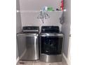 Laundry room with a stackable washer and dryer at 3077 Brenton Manor Loop, Winter Haven, FL 33881