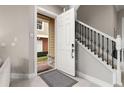 Interior view showing entryway with staircase and front door at 7585 Sunny Dreams Ln, Kissimmee, FL 34747