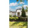 Front view of a single-story house with green landscaping at 7845 Wandering Way, Orlando, FL 32836