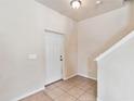 Bright foyer with tile flooring and staircase at 3804 Marietta Way, St Cloud, FL 34772