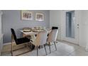 Bright dining area with modern table and chairs at 8912 Sydney Ave, Kissimmee, FL 34747