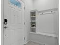 Bright entryway with built-in bench and storage at 8912 Sydney Ave, Kissimmee, FL 34747