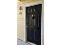 Condo entry door with black door and gold accents at 1025 S Hiawassee Rd # 2216, Orlando, FL 32835