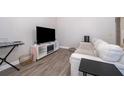 Living room with a sofa and TV at 1423 Farrindon Cir # 1423, Lake Mary, FL 32746