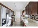 Modern kitchen with granite countertops and dark wood cabinets at 2108 Lemon St, Haines City, FL 33844