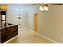 Dining area with tile floors and kitchen bar at 5773 Gatlin Ave # 627, Orlando, FL 32822