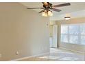 Bright living room with tile floors and ceiling fan at 5773 Gatlin Ave # 627, Orlando, FL 32822