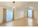 Bright and airy living room with tile floors and ceiling fan at 2907 Delcrest Dr, Orlando, FL 32817
