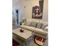Comfortable living room with large sofa and coffee table at 5140 Conroy Rd # 38, Orlando, FL 32811