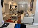 Living room with open floor plan to kitchen at 5140 Conroy Rd # 38, Orlando, FL 32811