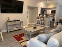 Open living room with modern furnishings and hardwood floors at 5140 Conroy Rd # 38, Orlando, FL 32811