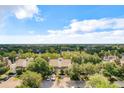 Community of two-story townhomes with ample parking and tree-lined streets at 7510 Seven Eagles Way # 7510, Reunion, FL 34747