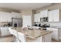 Modern kitchen featuring granite countertops and stainless steel appliances at 7635 Oakmoss Loop, Davenport, FL 33837